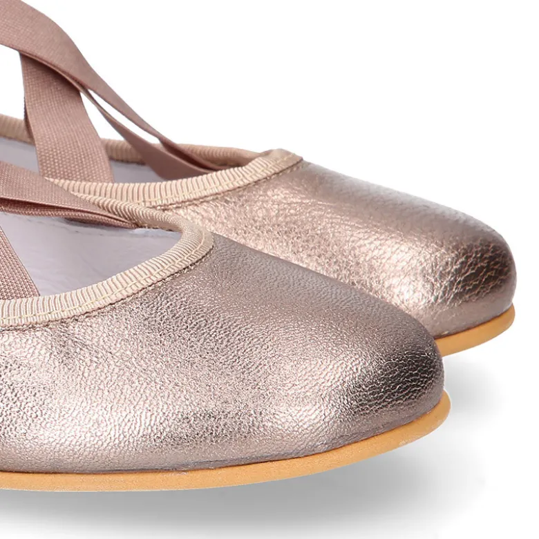 Bailarina niña tipo Ballet con cintas cruzadas elásticas en piel bronce.