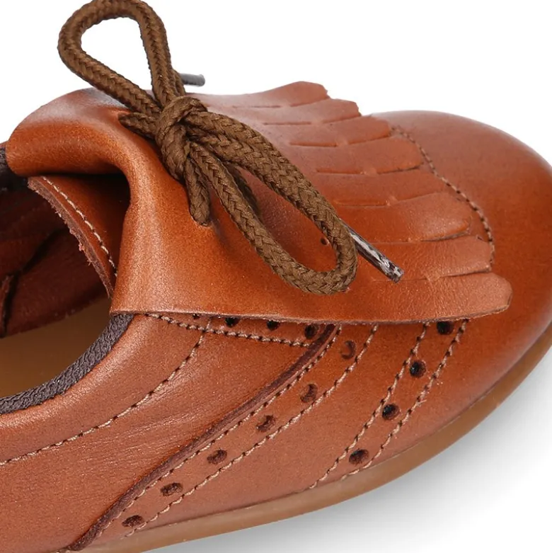 Blucher niños con lengüeta con flecos y picados en piel CUERO.