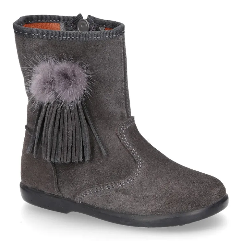 Bota niña con flecos y POMPONES de pelo en piel serraje.