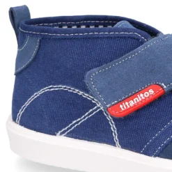 Bota tipo zapatilla sin cordones en lona y serraje.