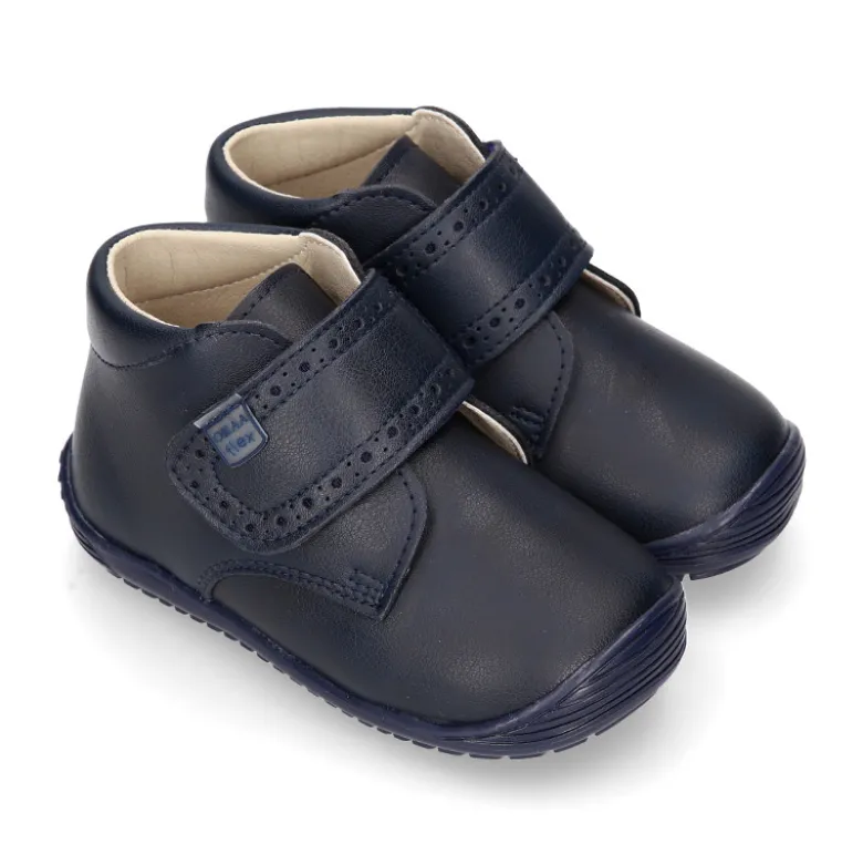 Botita casual respetuosa niños OKAA FLEX sin cordones y puntera en color MARINO.