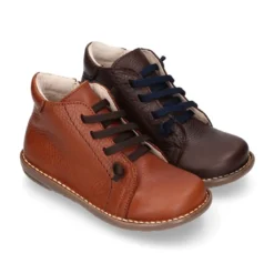 Botita niños SPORT con cremallera y cordones elásticos en piel.