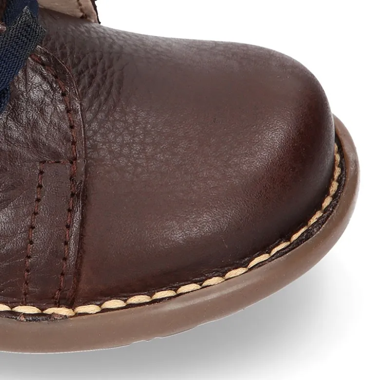 Botita niños SPORT con cremallera y cordones elásticos en piel.