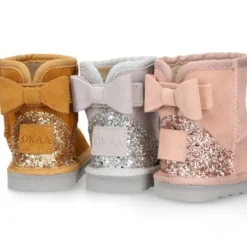 Botitas niña tipo Australianas niña en piel serraje con LAZO y GLITTER.
