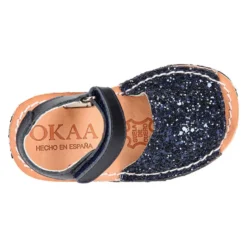 Menorquina con cierre adherente en piel con acabado GLITTER.