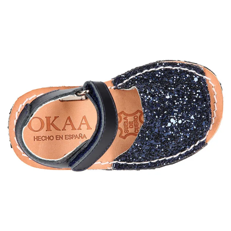 Menorquina con cierre adherente en piel con acabado GLITTER.
