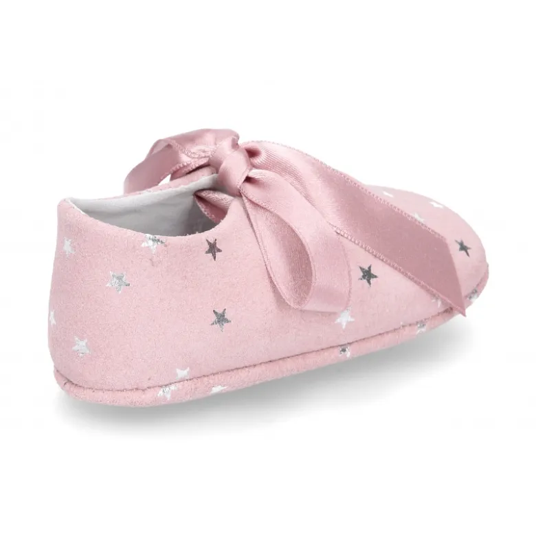 Mercedita bebé con lazo en piel serraje con ESTRELLAS.
