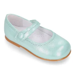 Mercedita niña con cierre adherente con botón en piel suave METALIZADA.