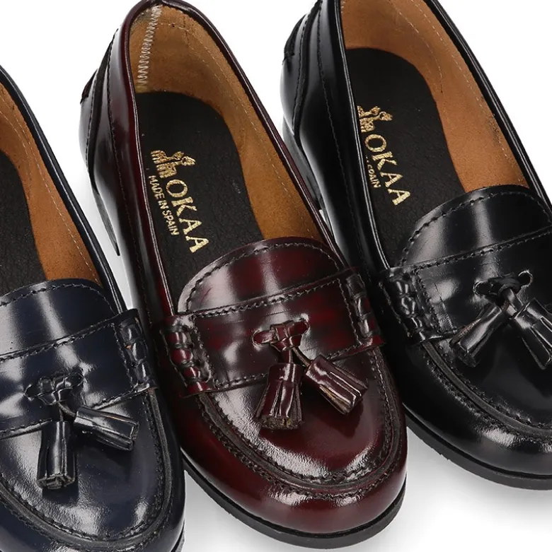 Mocasín NIÑA colegial con borlas en piel Antik.