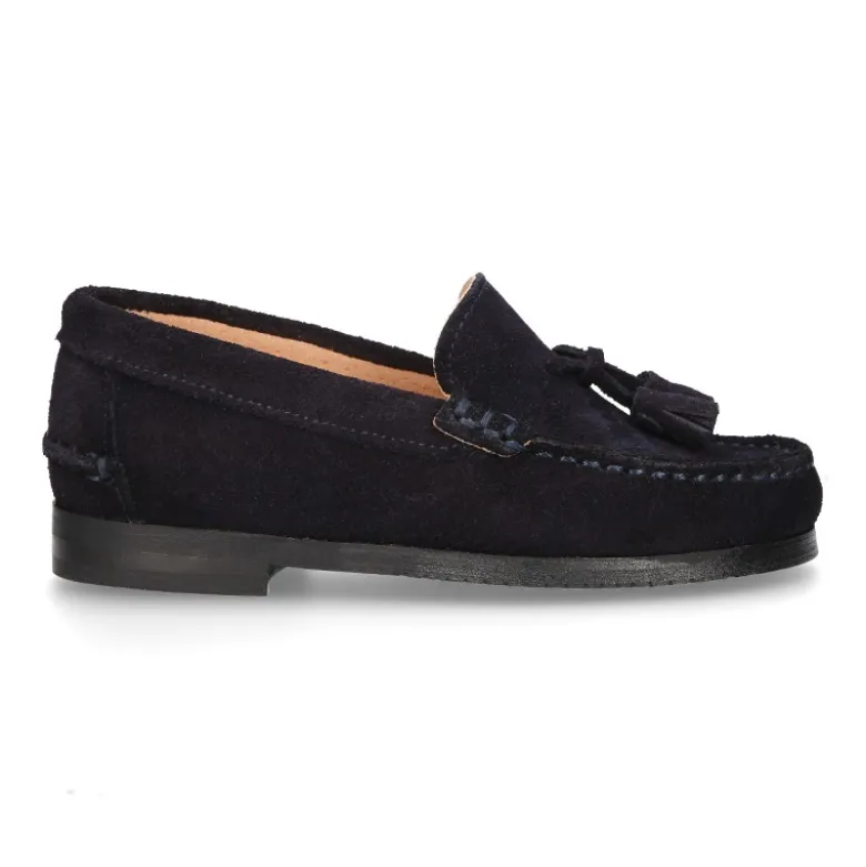 Mocasín niño borlas suela gruesa en piel serraje.