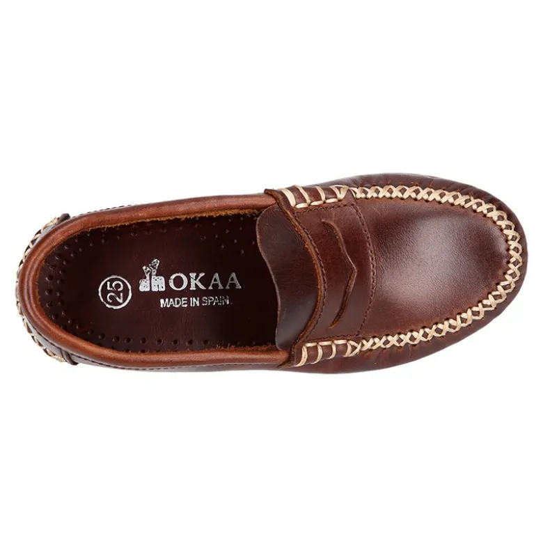 Mocasín niños antifaz en piel trabajada en colores clásicos.