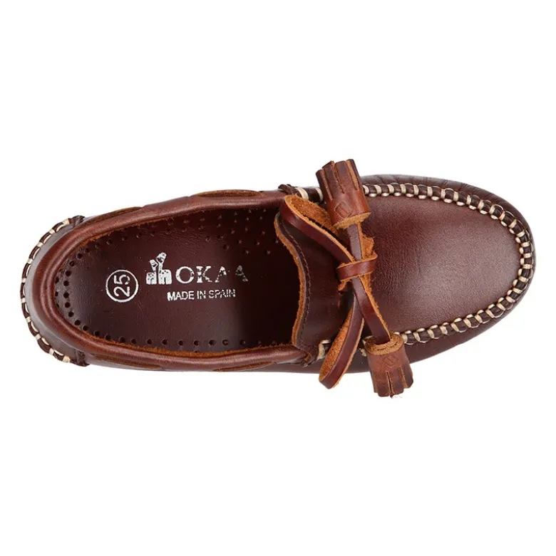 Mocasín niños lazos y BORLAS en piel trabajada en color cuero.