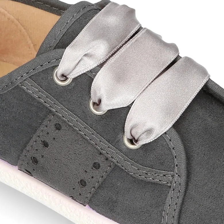 Nueva zapatilla MODA en lona serratex con lazos y picados.