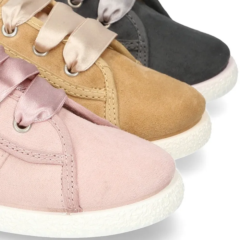 Nueva zapatilla MODA en lona serratex con lazos y picados.