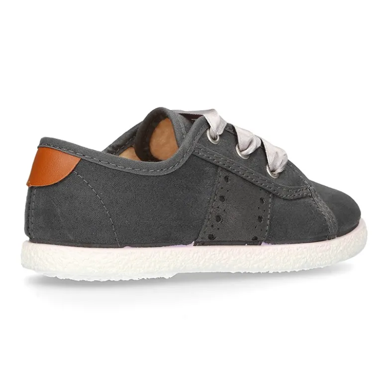 Nueva zapatilla MODA en lona serratex con lazos y picados.