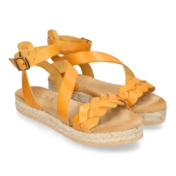 Sandalia Niña tipo alpargata en piel atada al tobillo y diseño trenzado.