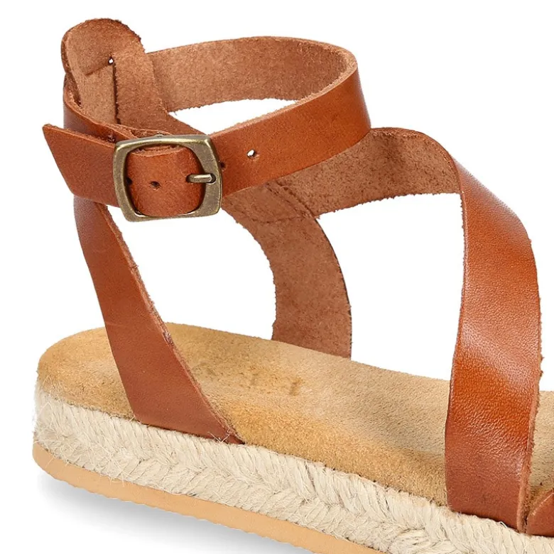Sandalia Niña tipo alpargata en piel atada al tobillo y diseño trenzado.