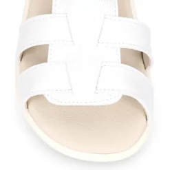 Sandalia niños Okaa Flex sin cordones en micro punto en color blanco.