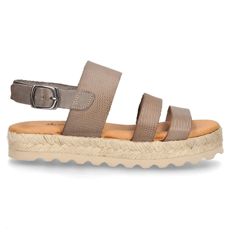 Sandalias tipo alpargata con tiras grabadas en piel.