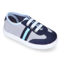 Tenis niño combinado en lona con cordones.