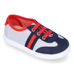 Tenis niño combinado en lona con cordones.