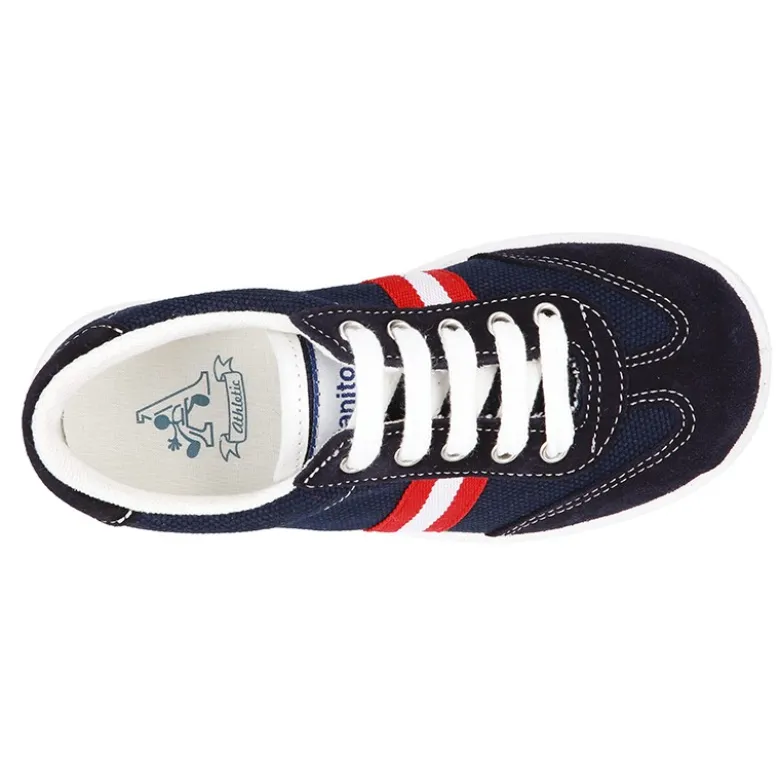 Tenis niño combinado en lona y serraje con cordones.