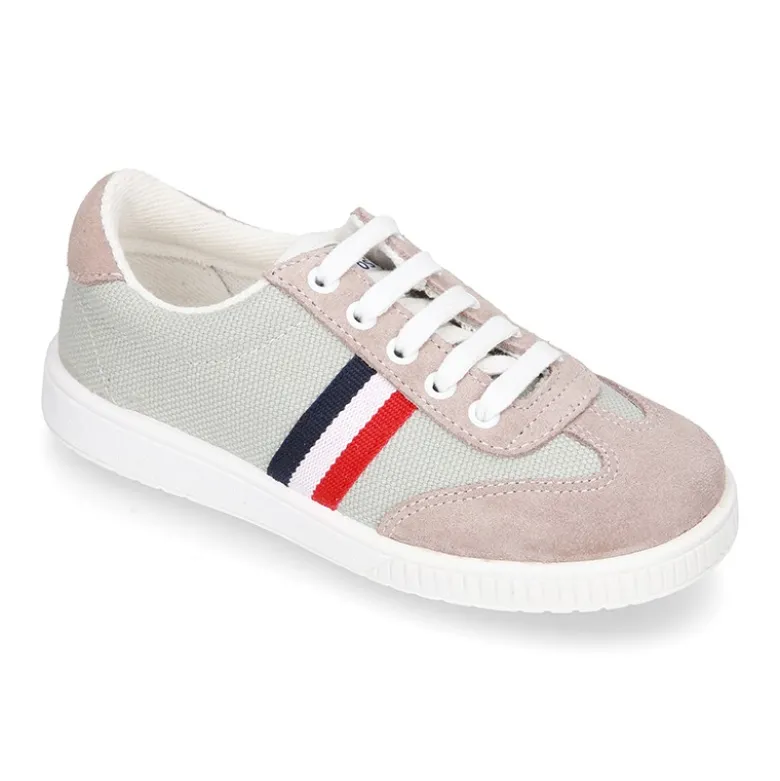 Tenis niño combinado en lona y serraje con cordones.
