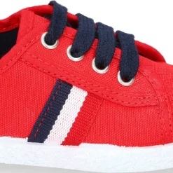 Tenis niño con cordones en lona con bandera.