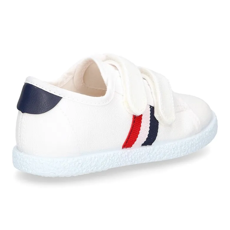 Tenis niño sin cordones en lona con bandera.