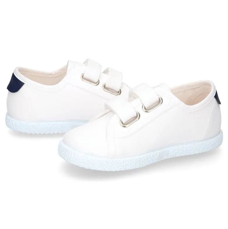 Tenis niño sin cordones en lona con bandera.