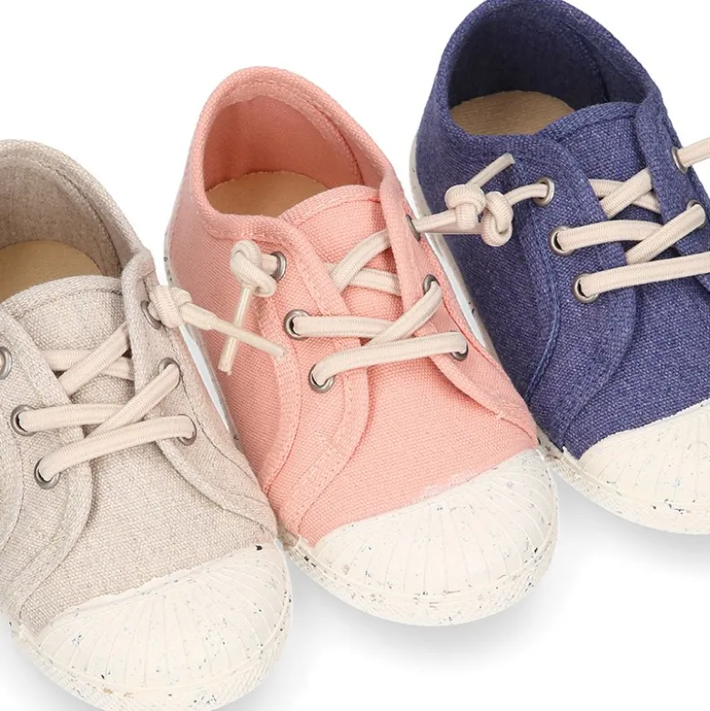 Zapatilla niño con puntera y cordones elásticos en lona algodón RECICLADO en colores suaves.