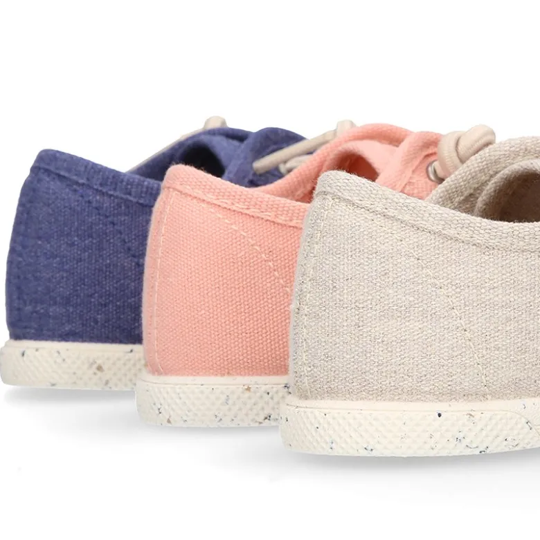Zapatilla niño con puntera y cordones elásticos en lona algodón RECICLADO en colores suaves.