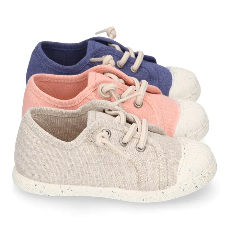 Zapatilla niño con puntera y cordones elásticos en lona algodón RECICLADO en colores suaves.