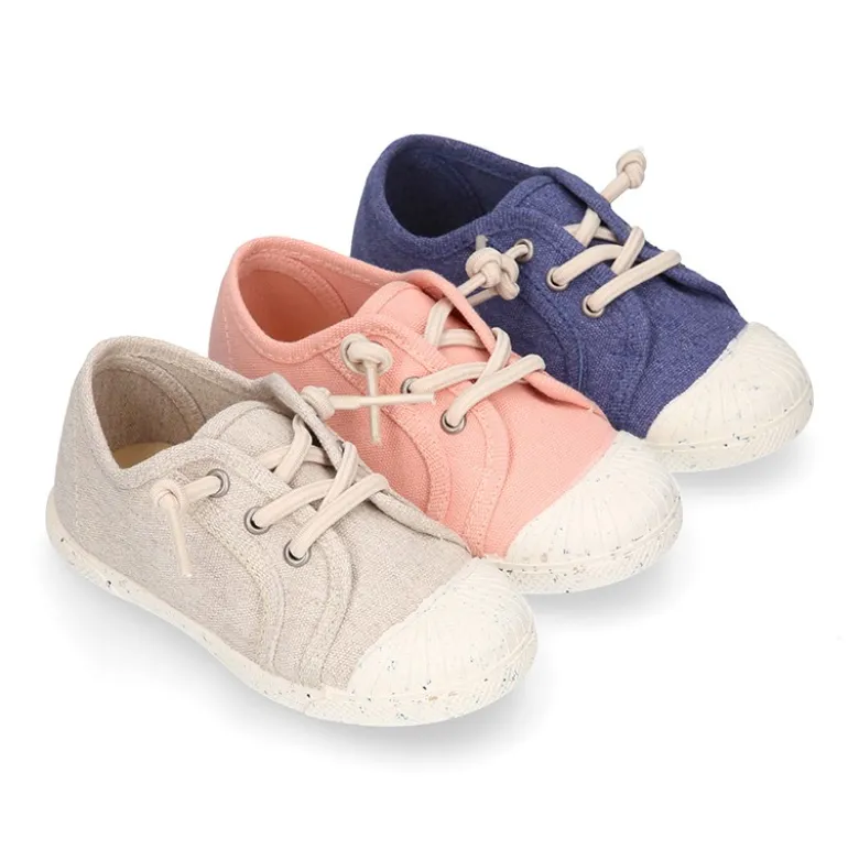 Zapatilla niño con puntera y cordones elásticos en lona algodón RECICLADO en colores suaves.