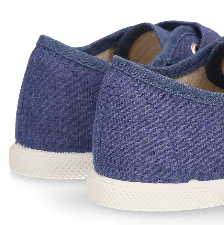 Zapatilla niño con puntera y sin cordones en lona piqué algodón en color JEANS.