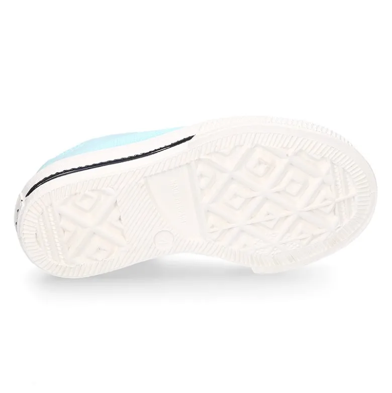 Zapatilla niños CASUAL con puntera y cordones en colores pasteles.