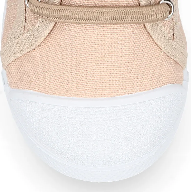 Zapatilla niños con puntera y cordones elásticos en lona en colores pastel.