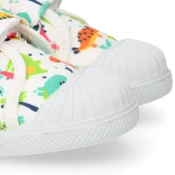 Zapatilla niño sin cordones en lona algodón estampado DINOS y puntera.