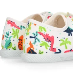 Zapatilla niño sin cordones en lona algodón estampado DINOS y puntera.