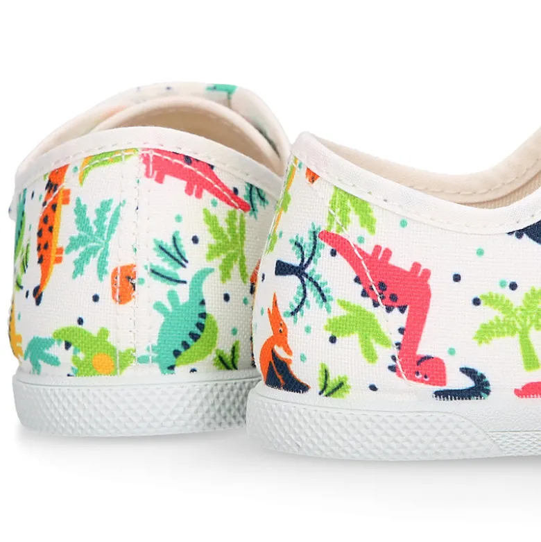 Zapatilla niño sin cordones en lona algodón estampado DINOS y puntera.