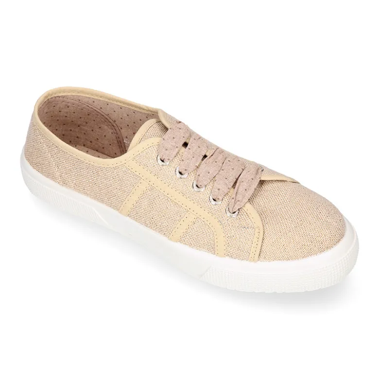 Zapatilla tipo bamba con cordones en lona lino metalizado.