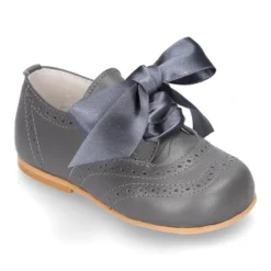 Zapatito clásico tipo INGLÉS con lazo seda en piel napa.