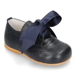 Zapatito clásico tipo INGLÉS con lazo seda en piel napa.