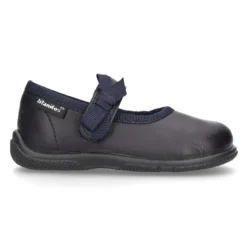 Zapato colegial tipo Mercedita con cierre adherente con lazo en piel lavable para niñas pequeñas.