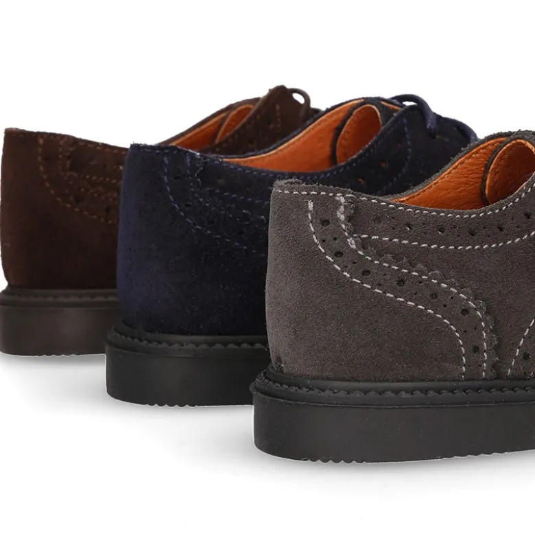 Zapato vestir Niño tipo Blucher con cordones y picados en piel Serraje.